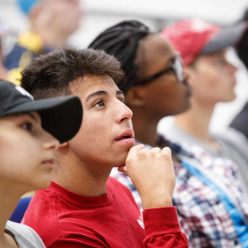 Students listening in a classroom.