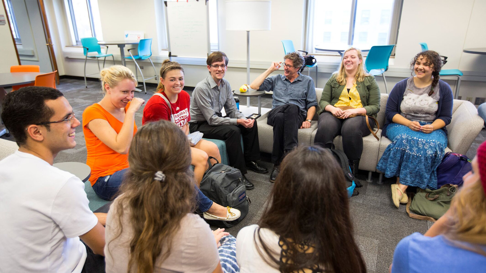Students having a discussion in a classroom.